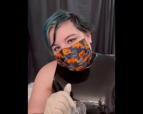 Girl in latex plays with cum