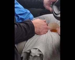 girlfriend drinks a big cup of very yellow piss in car.