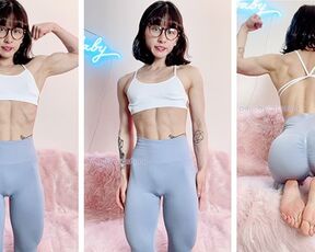 Adorable petite and nerdy Asian muscle girl flexes for you in leggings